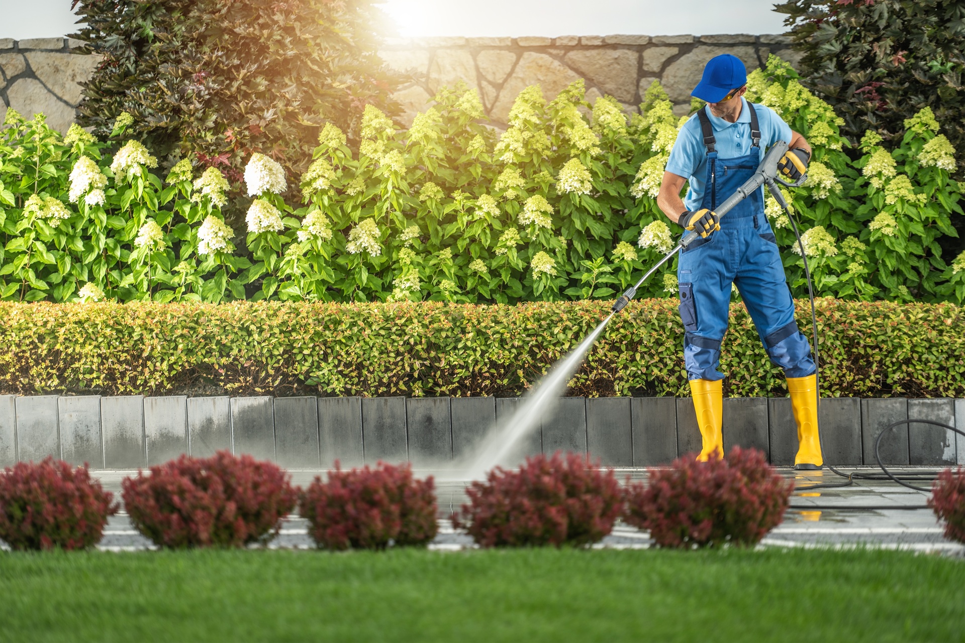 Caucasian,Worker,Washing,Elegant,Residential,Driveway,Using,Pressure,Washer