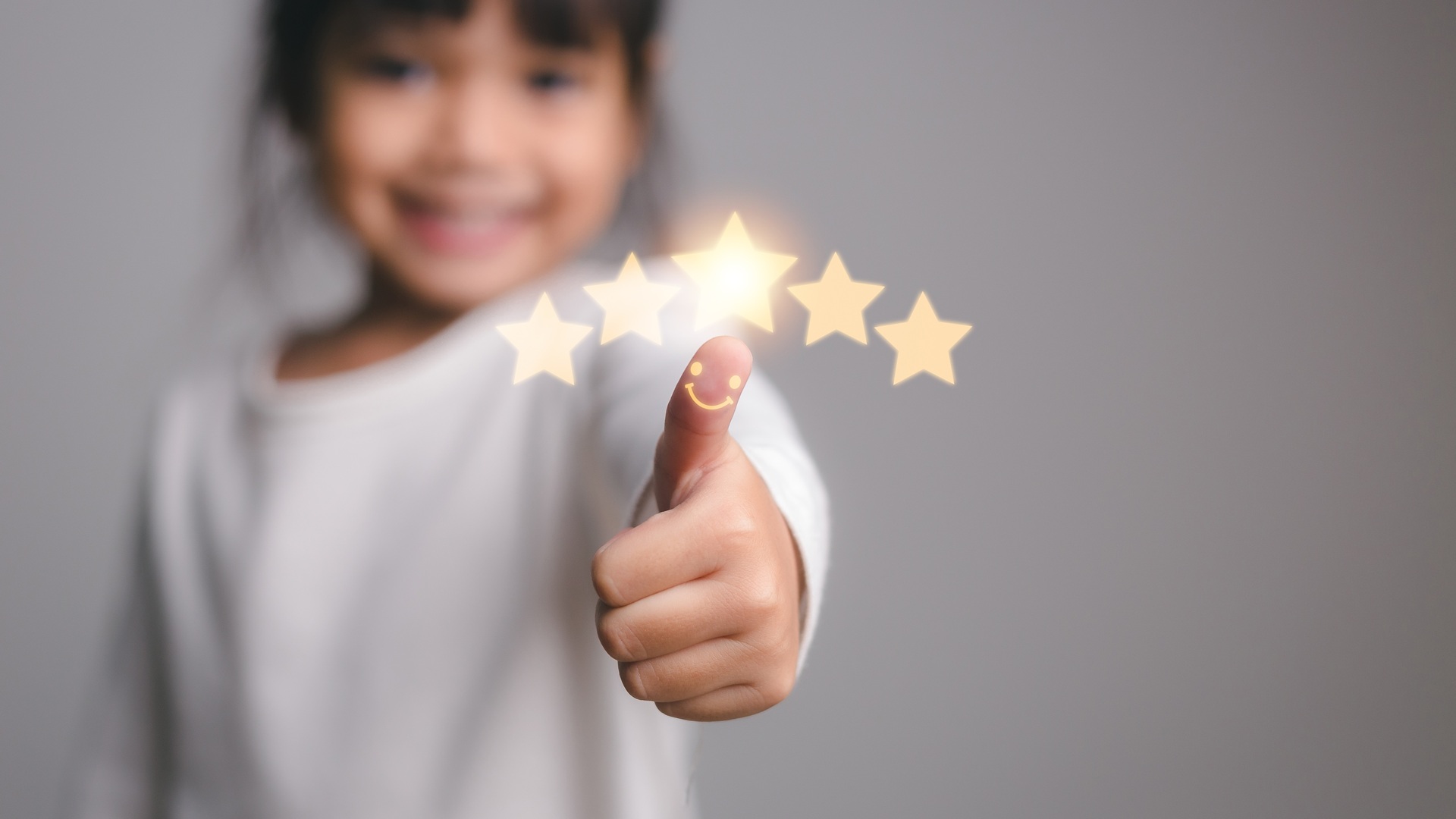 Cute,Little,Girl,Giving,Thumbs,Up,With,5,Stars,Approved