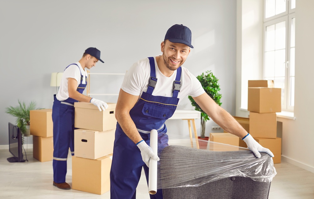 Young,Mover,Man,Furniture,Plastic,Wrap,For,Moving,,Individual,,Company